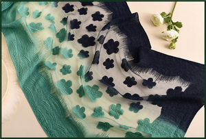 Mixture of green and dark navy embroidery style scarf.