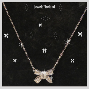 Bow shaped necklace with created diamonds
