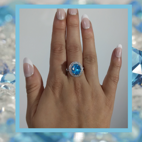 Created Blue topaz ring with micro simulated diamonds surround
