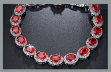 Dazzling circular red stone bracelet with lab created diamonds